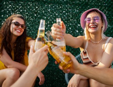 Female friends having fun and drinking beer