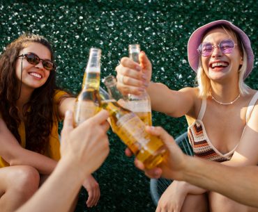 Female friends having fun and drinking beer