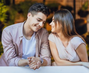 Young couple smiling at each other