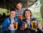 Three singles drinking beer in pub