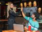 Girl giving high-five to a guy in a bar