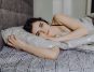 Beautiful young woman lying on the sofa
