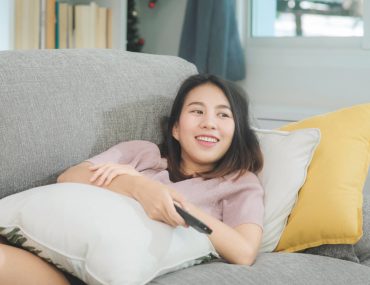 Young woman lying on a sofa
