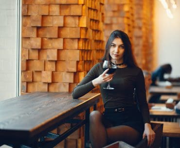 Cincinnati Hookup | Where to Pick Up and Date Girls in Cincinnati Elegant woman on red lipstick having a drink at the bank