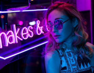 Cinematic night portrait of girl and neon lights