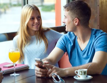 Two people on a date in a cafe