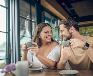 Fort Lauderdale Hookup | Where to Pick Up and Date Girls in Fort Lauderdale Long haired woman and bearded man smiling at each other during a cafe date