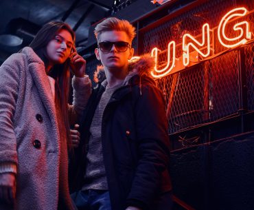 Kansas City Hookup | Where to Pick Up and Date Girls in Kansas City Young man and woman dressed casually standing in front of a lounge at night