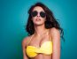 Young woman wearing a yellow bikini bra
