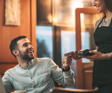 Miami Hookup | Where to Pick Up and Date Girls in Miami Waitress serving coffee to a man waiting for his date in a cafe
