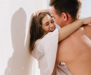 Modesto Hookup | Where to Pick Up and Date Girls in Modesto Man pinning a woman to the wall passionately