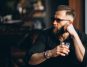 Bearded man having a drink in a bar