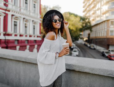 Smiling woman holding a cup of coffee