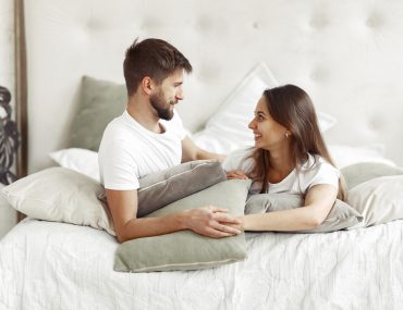 Couple sitting on the bed