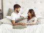 Couple sitting on the bed