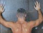 Young man taking a shower