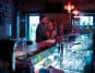 Couple about to kiss in a bar