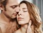 Closeup picture of a shirtless man gently holding a woman's neck while trying to kiss her